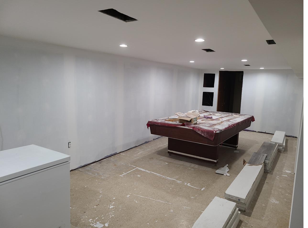Basement mid-renovation, framed and drywalled