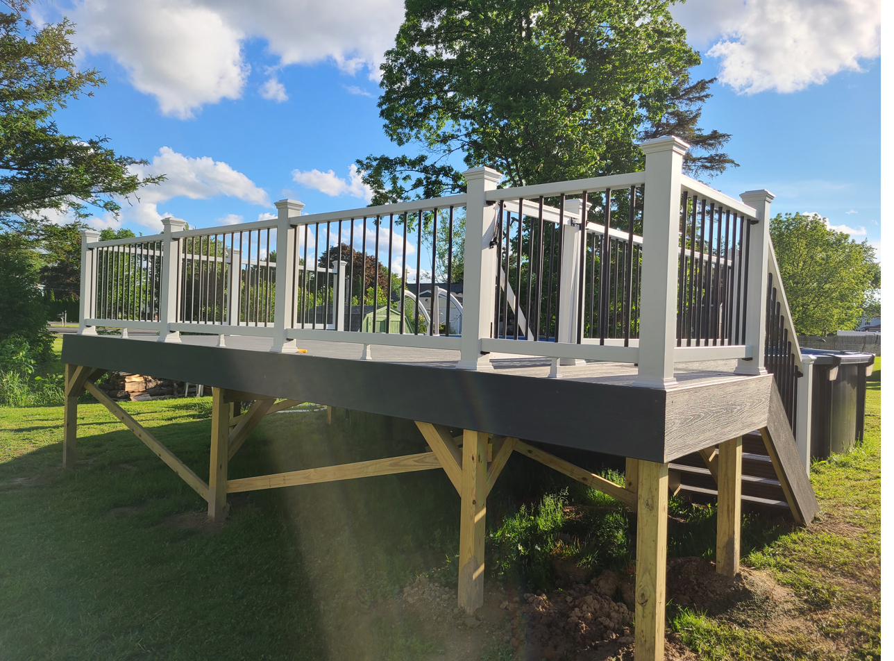 Large composite deck with white and black vinyl railing