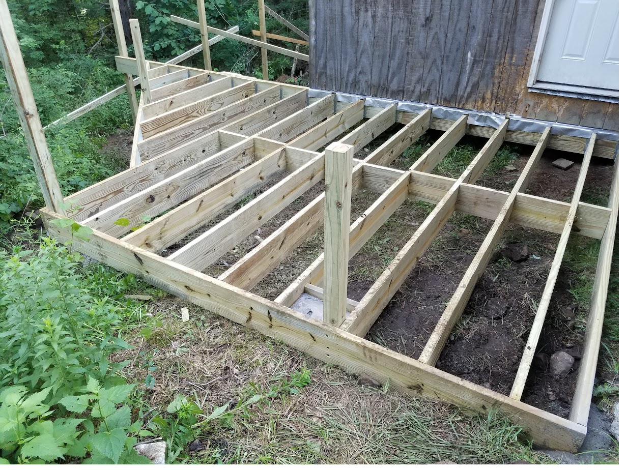 Deck framing mid-build, before decking and railing go on